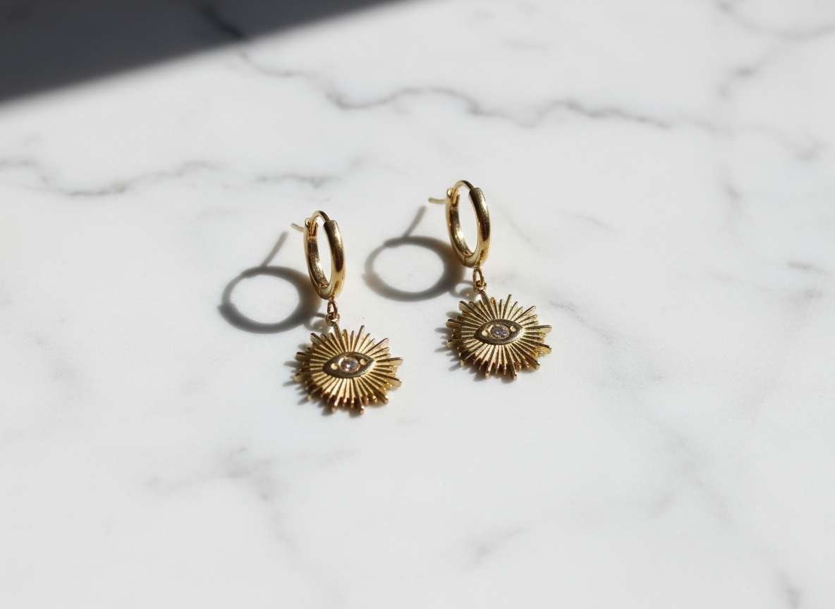 Pendientes Destello Divino sobre mármol