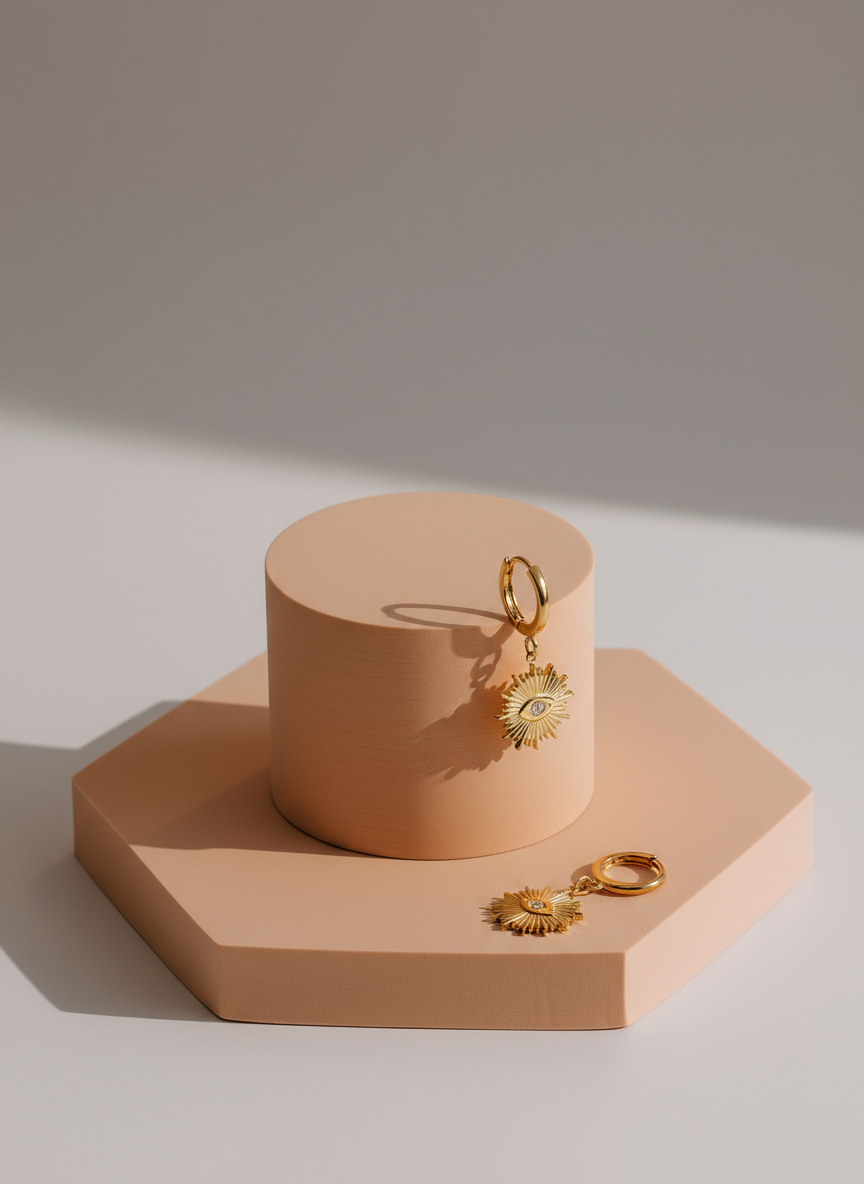 Pendientes Destello Divino sobre pedestales beige